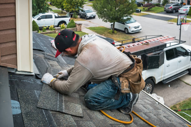 Professional Roofing technician working in Calverton, NY